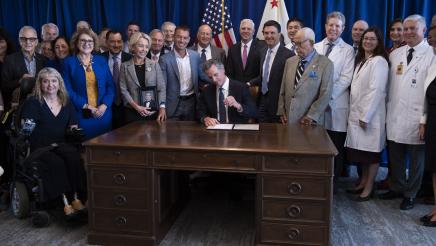 Group photo of attendees with Governor Newson at the AB 35 Bill Signing event