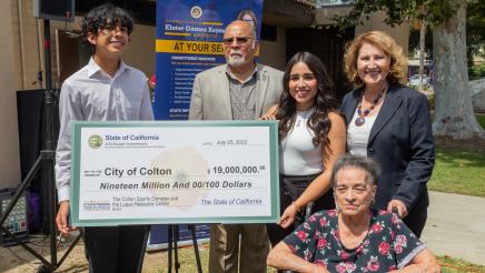 Majority Leader Reyes presenting a check to the City of Colton