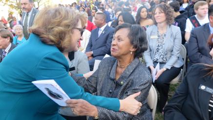 Assemblymember Reyes shaking hands with guest at unveiling 