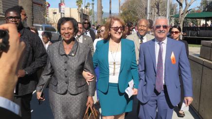 Assemblymember Reyes walking with guest 