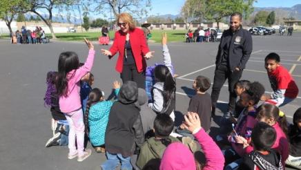 Assembly Member Eloise Gomez Reyes with students at Roberts Elementary Career Day
