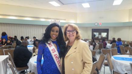 Assemblymember Reyes taking a picture with Ms. US America 