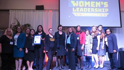 Assemblymember Reyes taking photo with the women of the conference