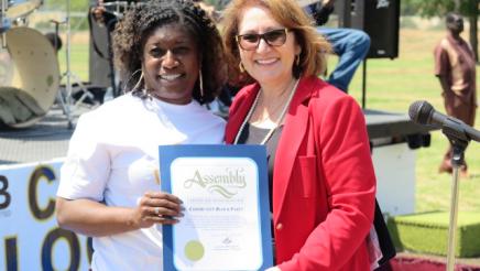 Assemblymember with community member
