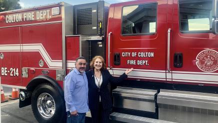 Reyes presenting Colton with a new fire engine